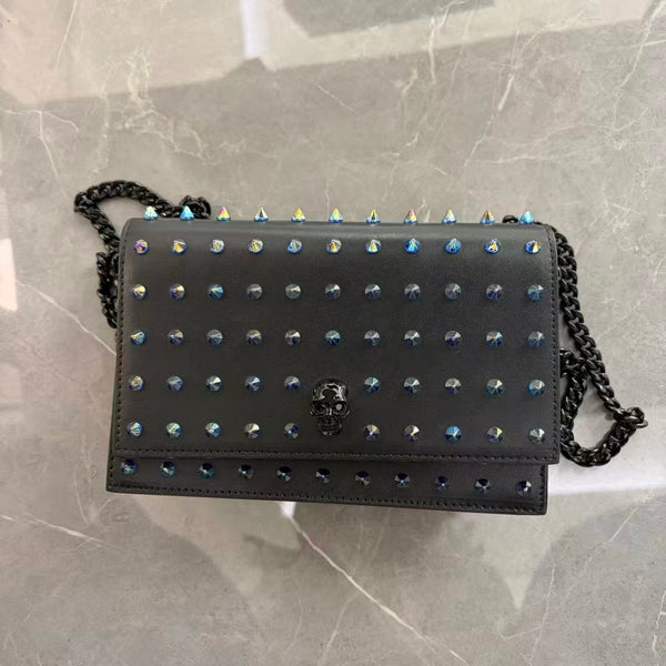 Alexander McQueen mini skull iridescent spike crossbody bag